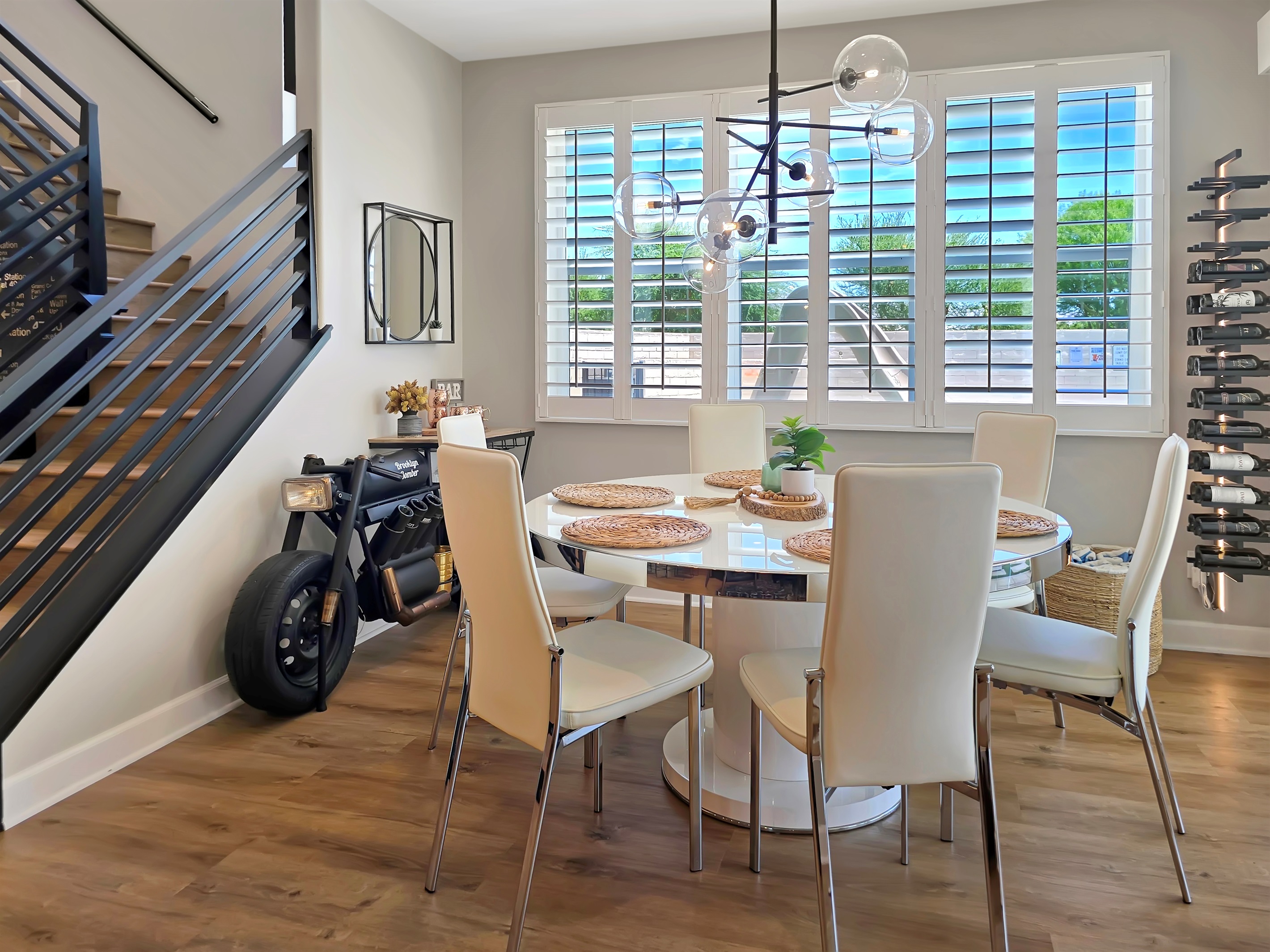 The dining chairs tilt back to encourage supreme relaxation and the chandelier by Arhaus commands attention of its own! Experience dining at home like never before. 
