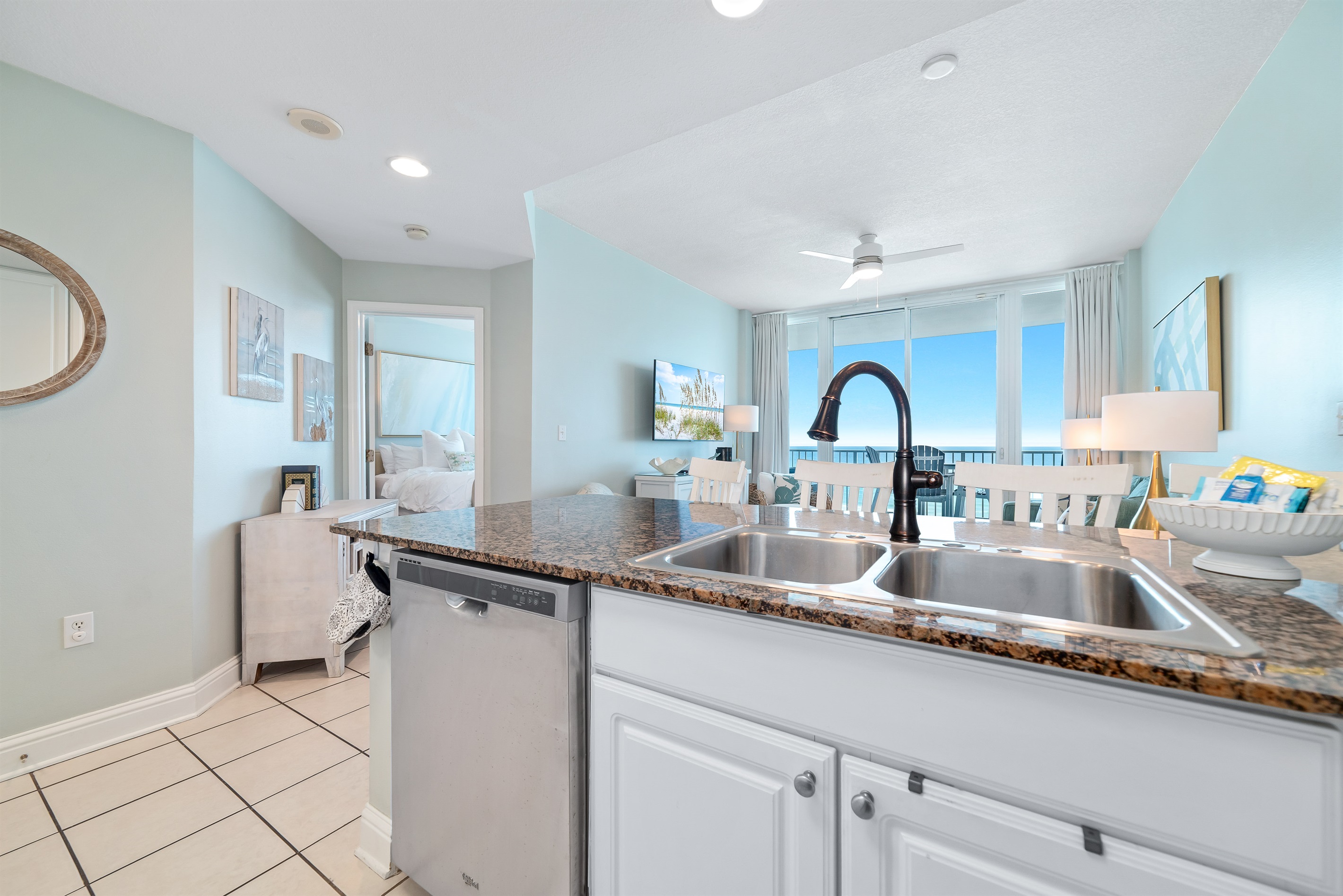 Fully-equipped kitchen featuring high-end appliances and inspiring sea vistas seamlessly flow between the living and dining areas.