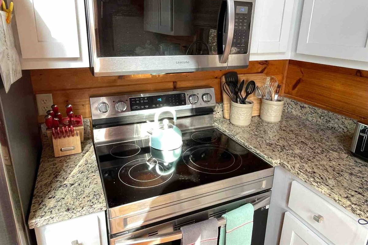 Kitchen stocked with pots, pans, and many utensils