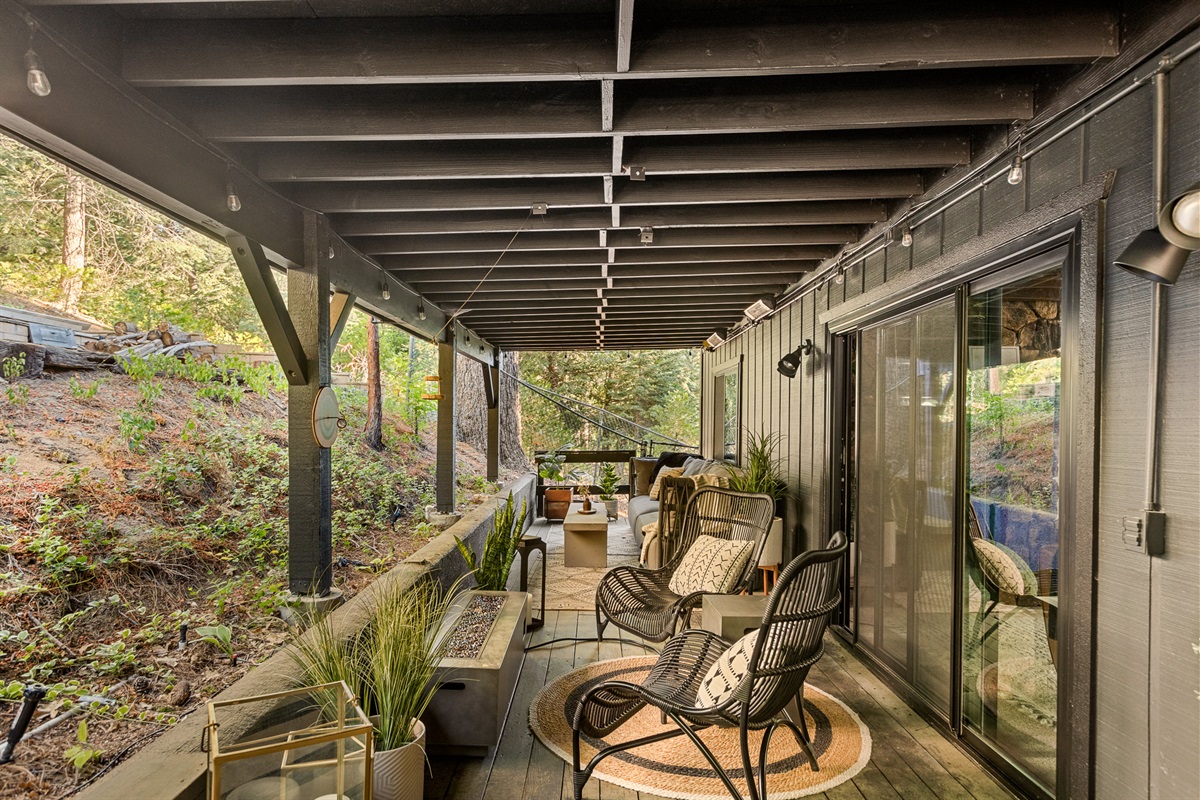 The expansive lower floor patio, complete with a fully sealed upper deck, allowing you to sit and joy the outdoors, even when it rains!  And don't forget there's a fire pit and space heaters to keep you warm too.