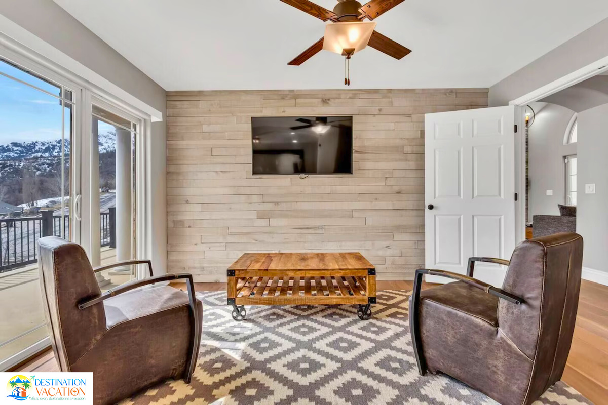 Rustic fireplace wall creates a warm gathering atmosphere.