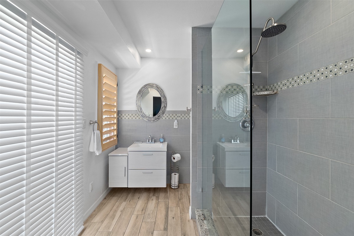 Modern walk-in shower with coastal tile design