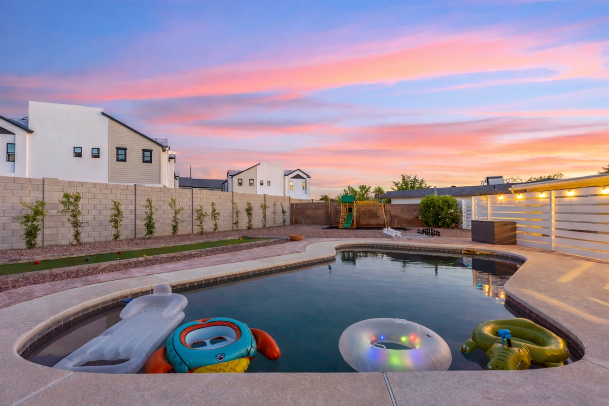 Enjoy the pool and yard toys provided in this oasis back yard shared with the other 3 units on the property.