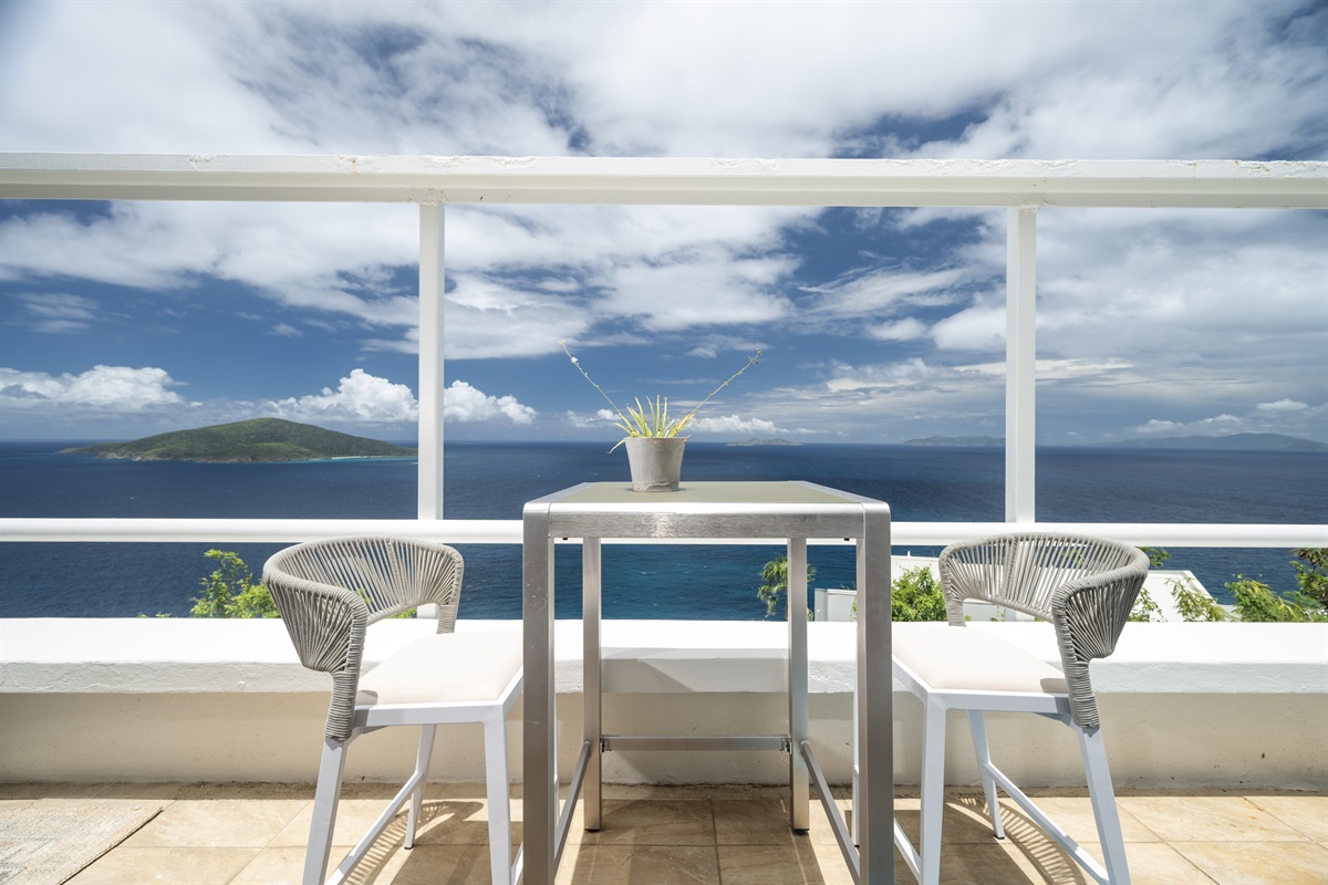 A private balcony offering endless ocean vistas.