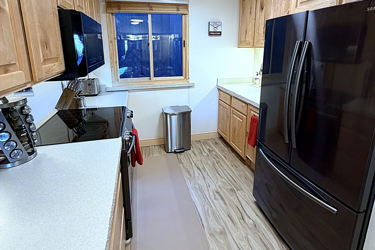 Feel right at home in the fully equipped kitchen featuring a coffee maker, dishwasher, toaster, and everything you need for easy meals and cozy mornings.