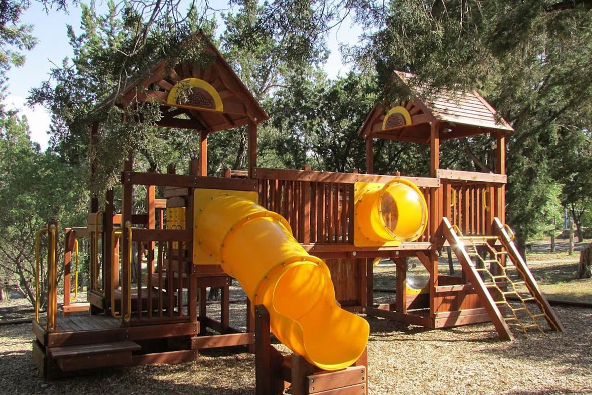Beach Club playground and green space give kids room to play.