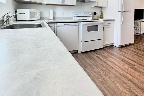 Brand new appliances and plenty of cabinet/prep space make this kitchen a home chef's dream!