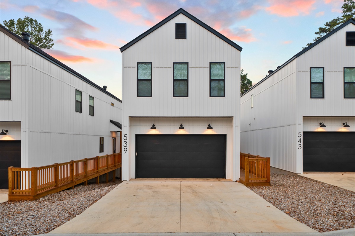 The homes sit along the water, creating a relaxed and private lakeside feel.