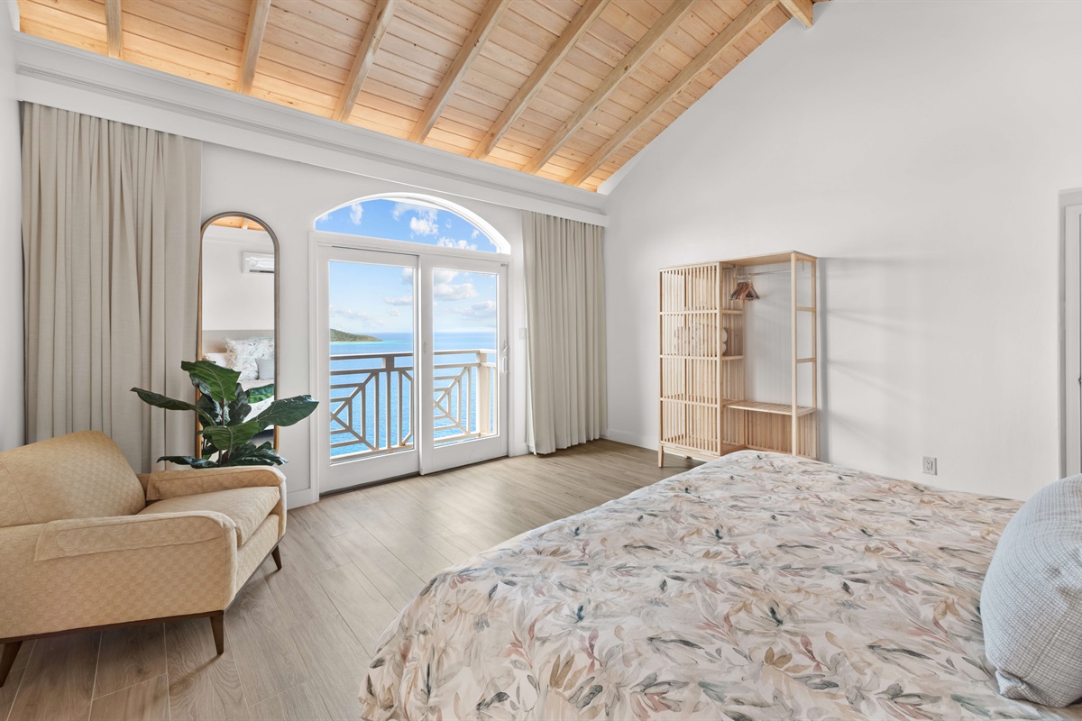 Spacious room with AC, vaulted ceilings, king bed, ensuite bathroom, and stylish island decor. A guest favorite.