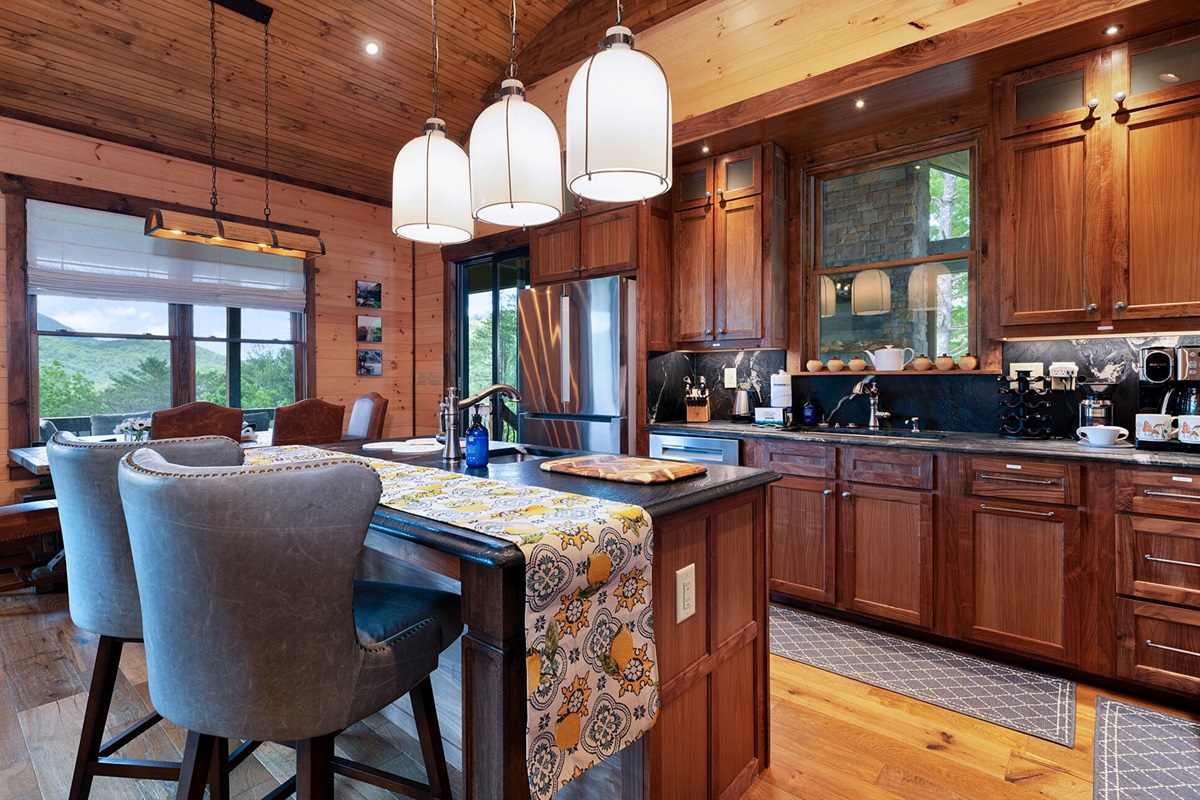 Gather around the kitchen island, a great spot for casual meals and conversations.