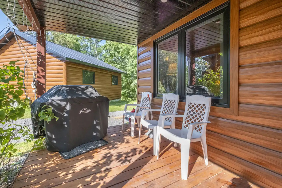 Private porch with outdoor seating and barbecue area