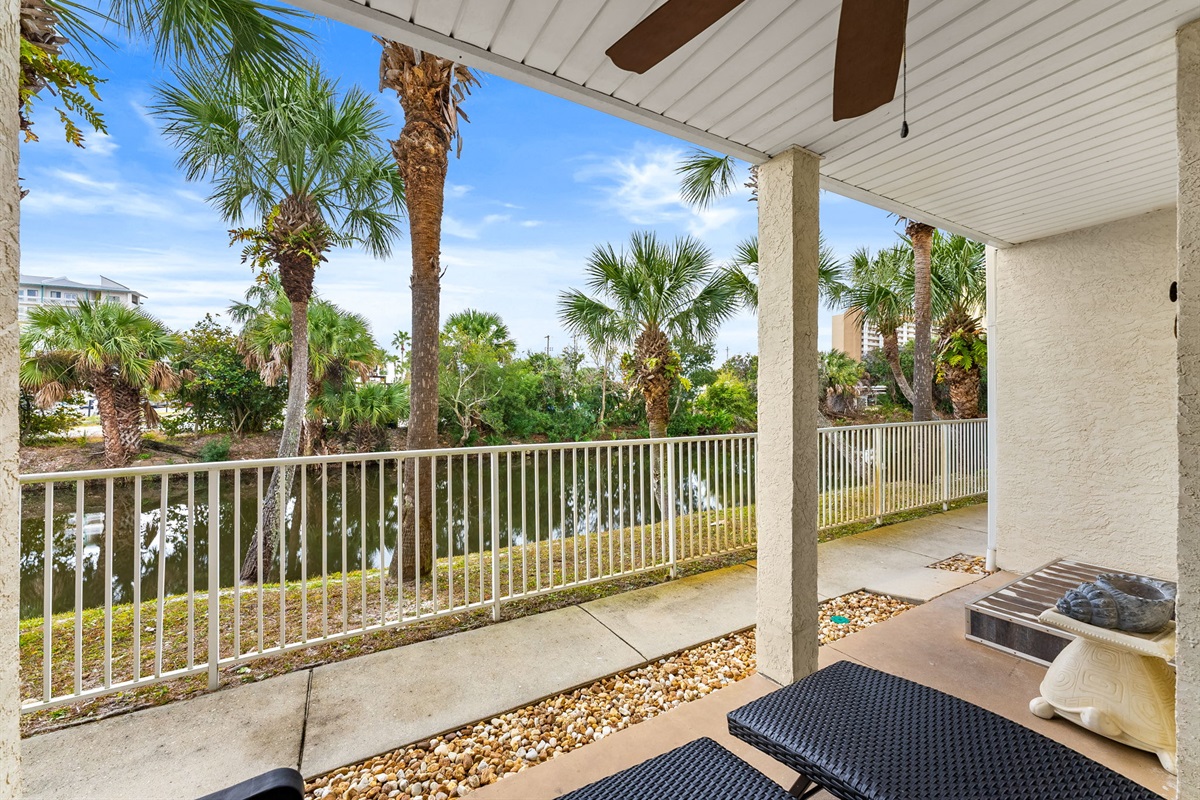 First-floor patio with peaceful lagoon views — perfect for morning coffee or evening unwinding. Quick, easy 2-minute stroll to beach access via sidewalk right out of your back door!