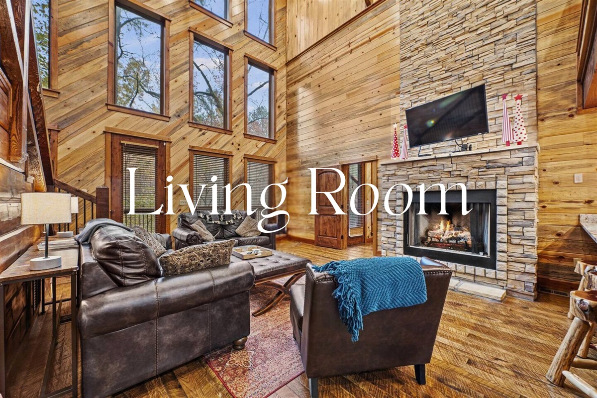Enjoy our open concept living area, ideal for family gatherings, featuring plush seating and a cozy fireplace.