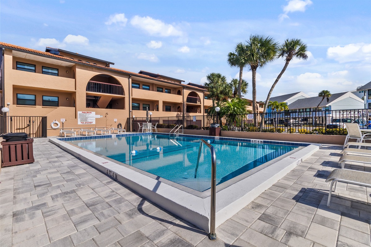 Heated pool is just steps away from the unit.