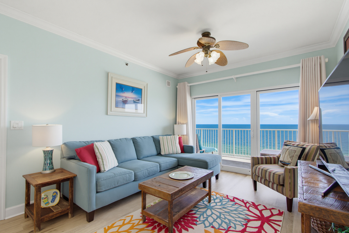 Comfortable Gulf-front living room with a wall-mounted TV.