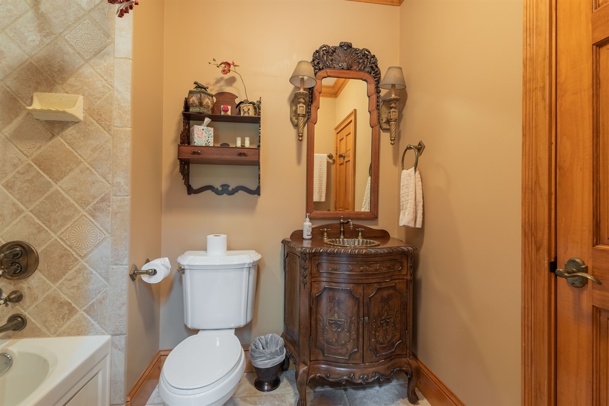 Rustic details and warm finishes give the bathroom a cozy mountain lodge feel while still offering comfort and convenience during your stay.