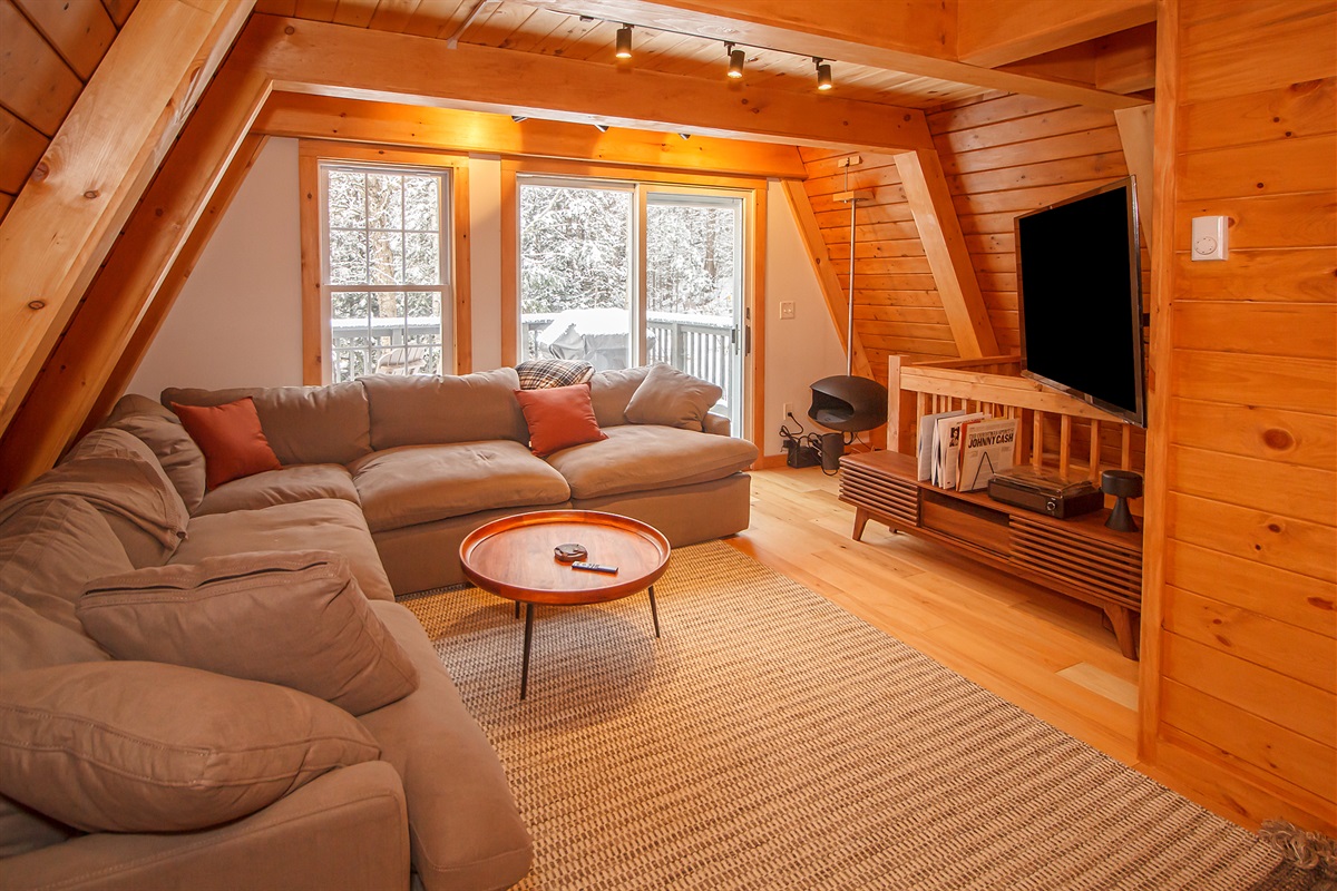 Living room with Smart TV and reclining couch