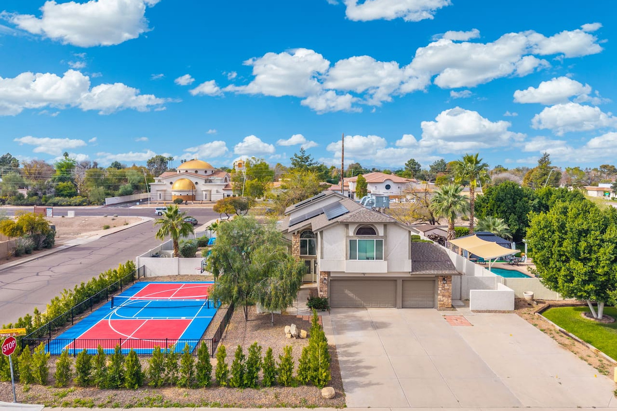 Your own sport court sets the stage for game days, with a refreshing pool just steps away.