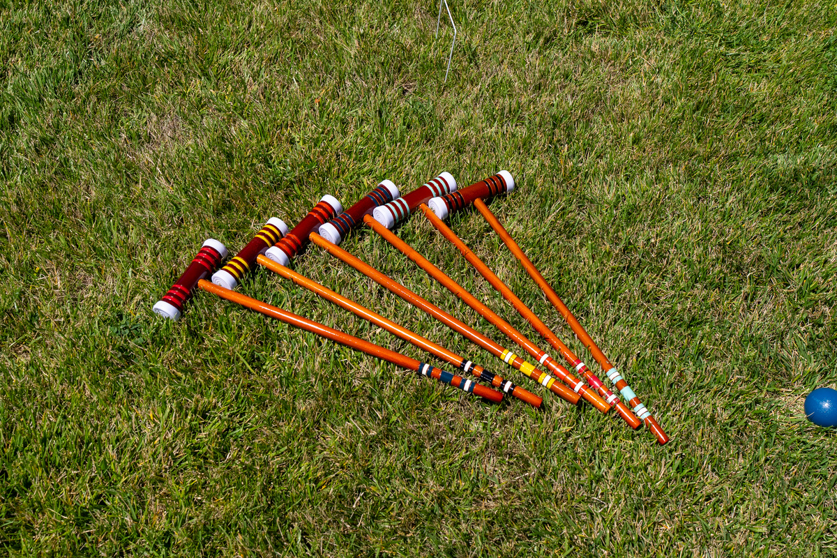 Enjoy a collection of lawn games in the backyard.