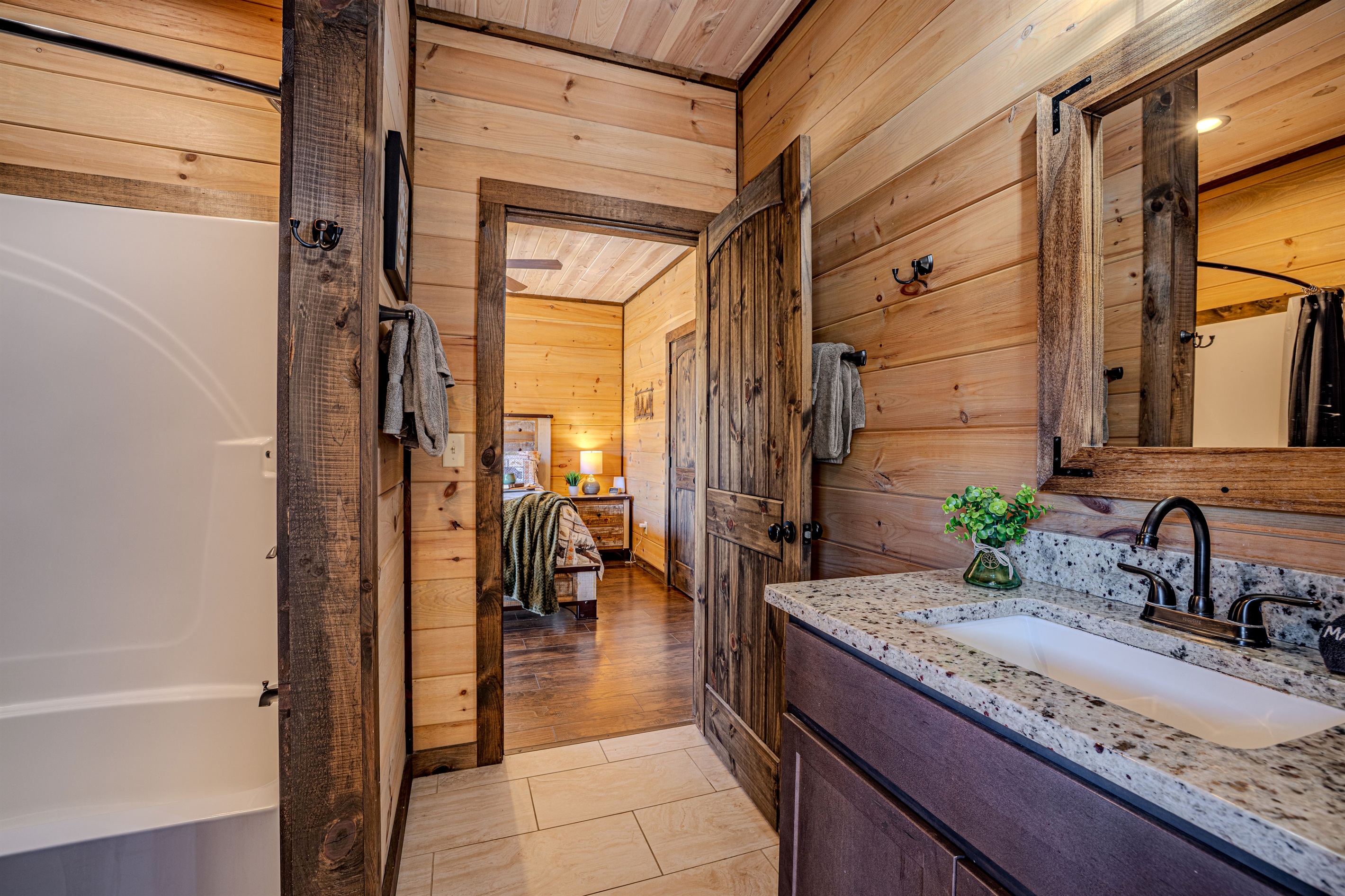Spacious jack-n-jill bathroom with a tub/shower combo and plenty of room for guests.