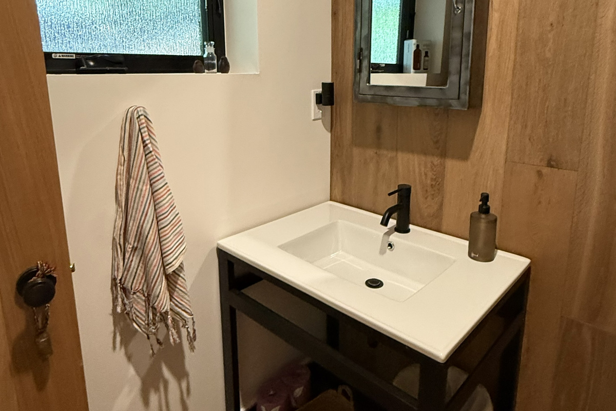The Powder Room, freely located next to the den, provides for quick commercial pit stops without going upstairs.