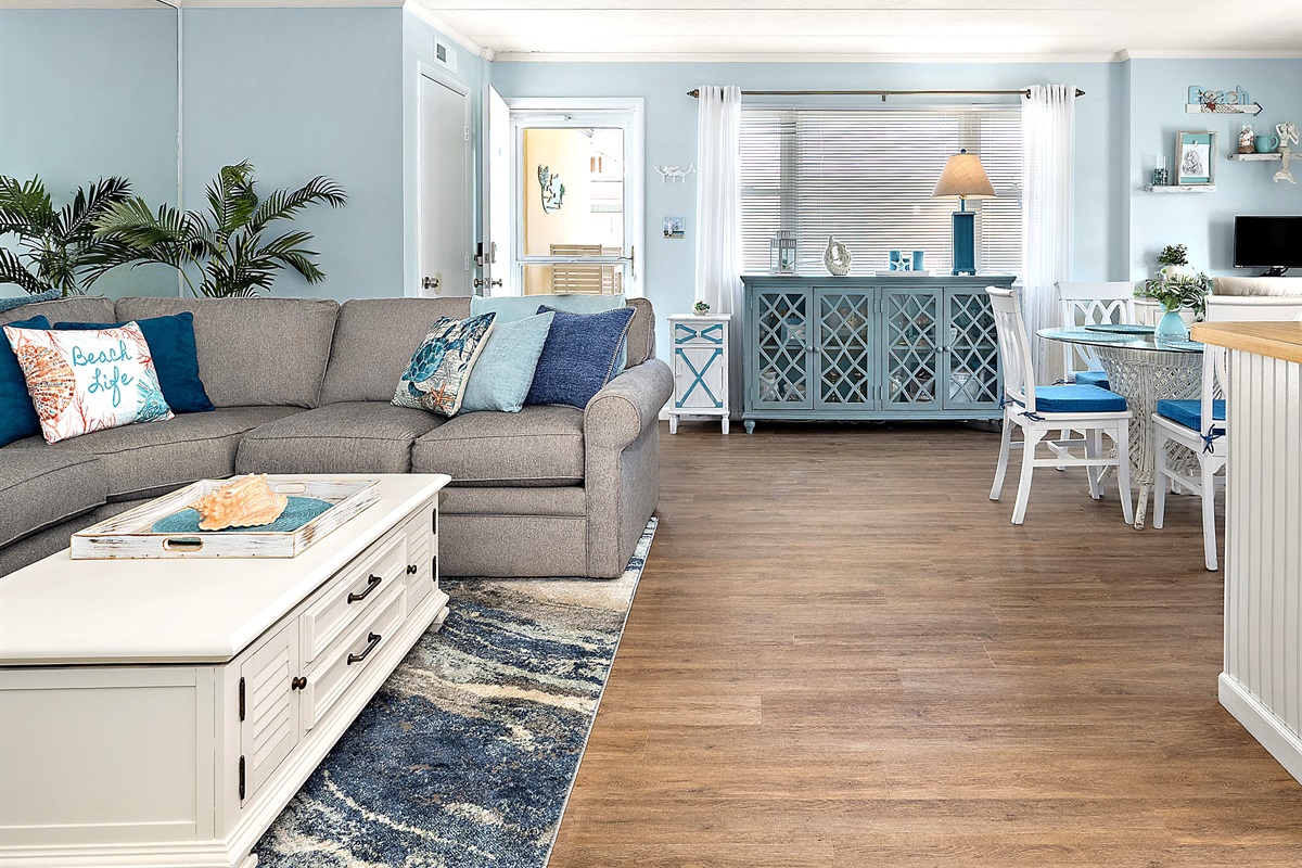 Open floor plan. Decorated in Coastal style
