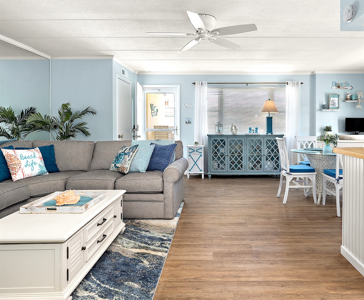Open floor plan. Decorated in Coastal style