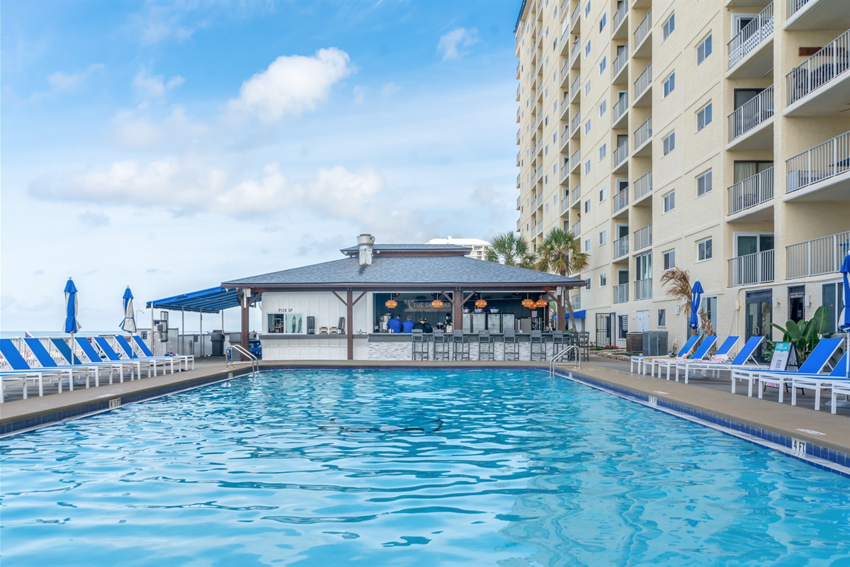Unwind by the oceanfront pool, where sun-kissed loungers and endless Gulf views set the tone for total relaxation.