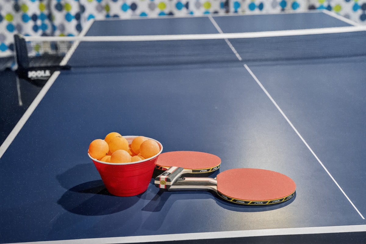 The basement game zone offers lively moments with ping pong!