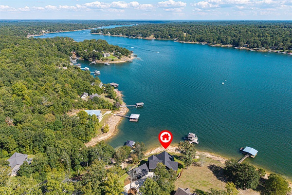 From above, you can see how peaceful it is — your own slice of shoreline surrounded by calm blue water and endless trees.