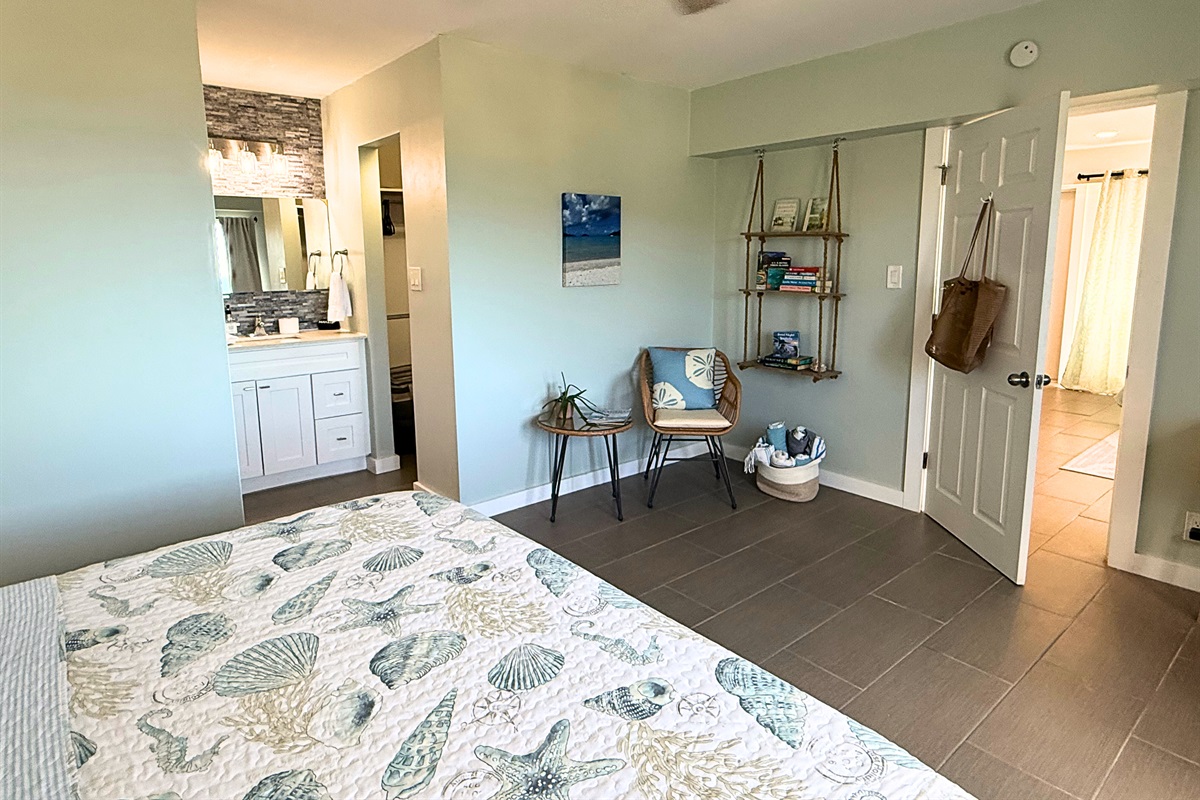 Primary suite has ceiling fan, sitting area, walk-in closet and ensuite bathroom