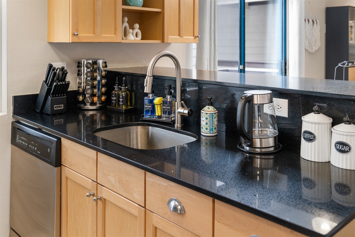 Kitchen with lots of stocked extras for all your cooking, living and staying, whether short or an extended stay.