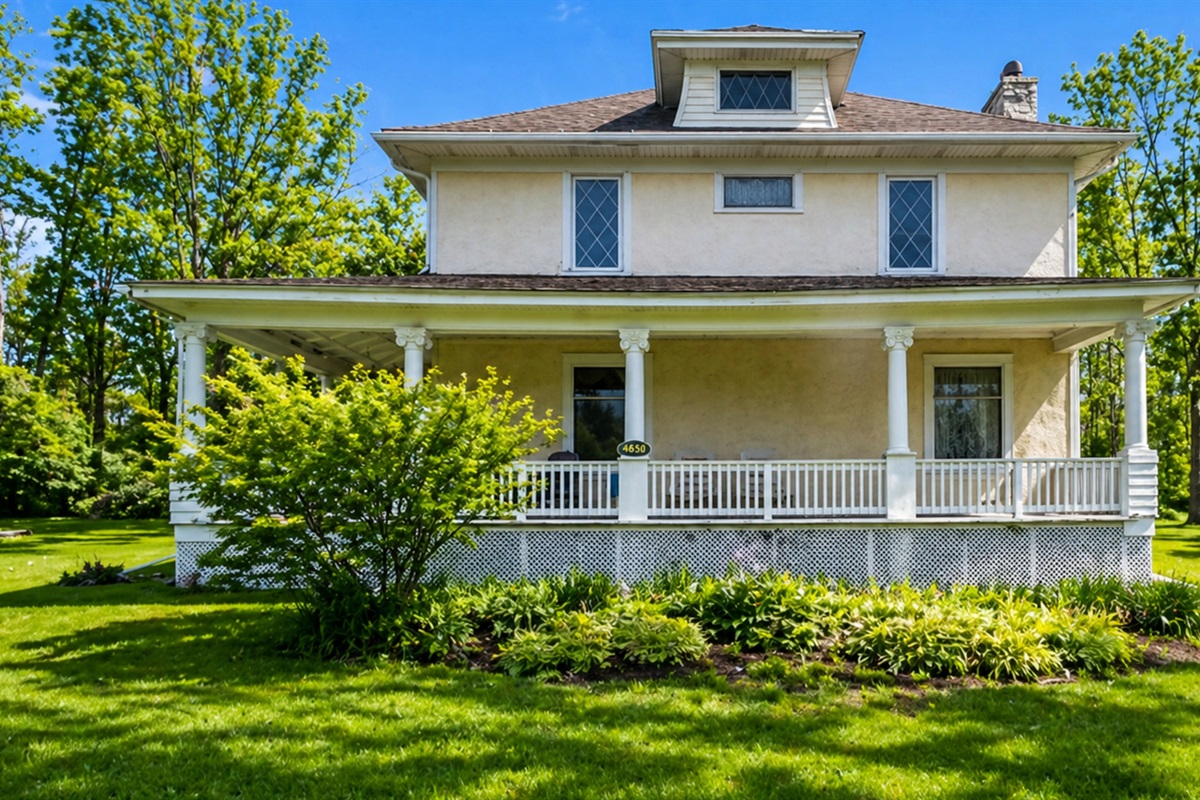 Charming early 20th-century home with original details and a full wraparound porch for relaxing summer evenings.
