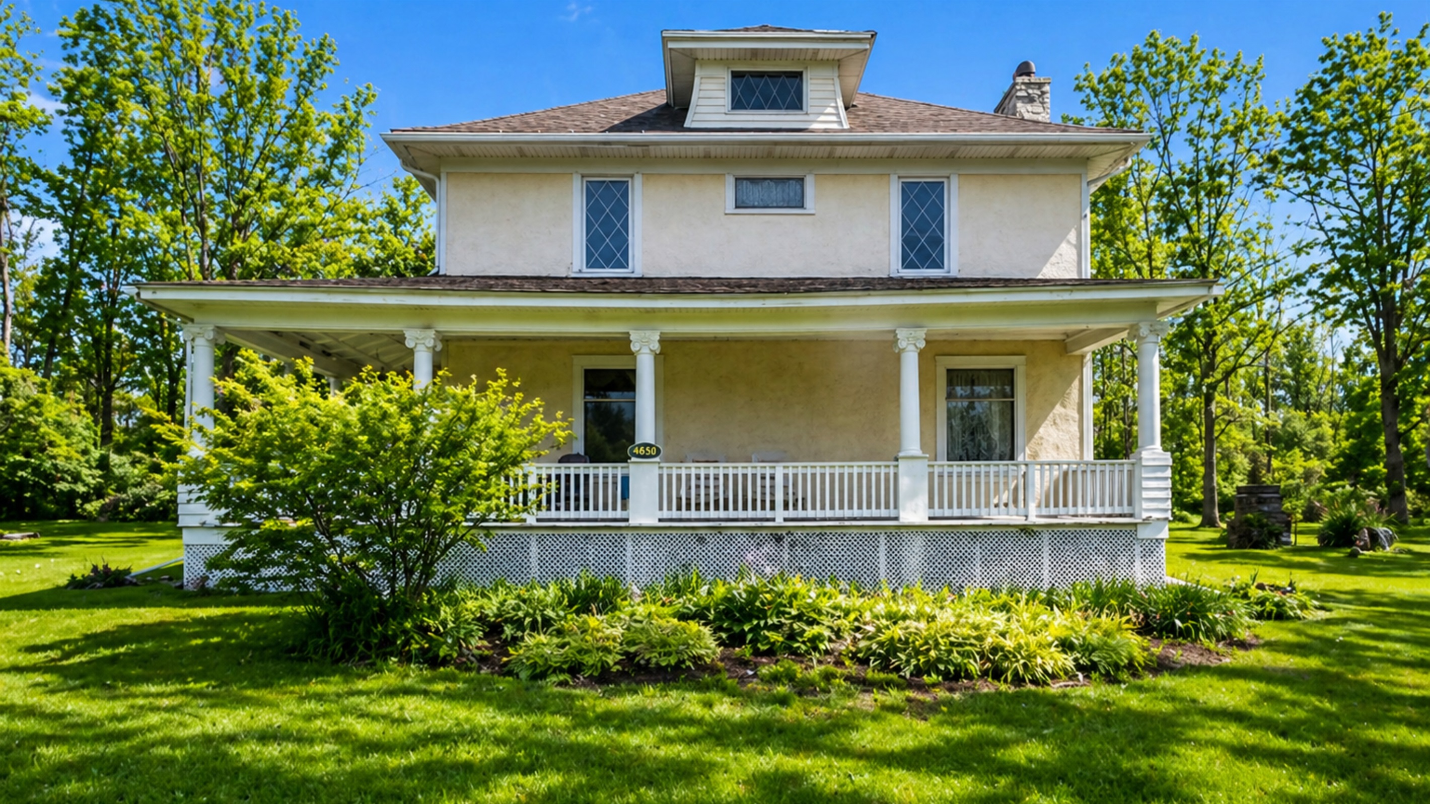 Charming early 20th-century home with original details and a full wraparound porch for relaxing summer evenings.