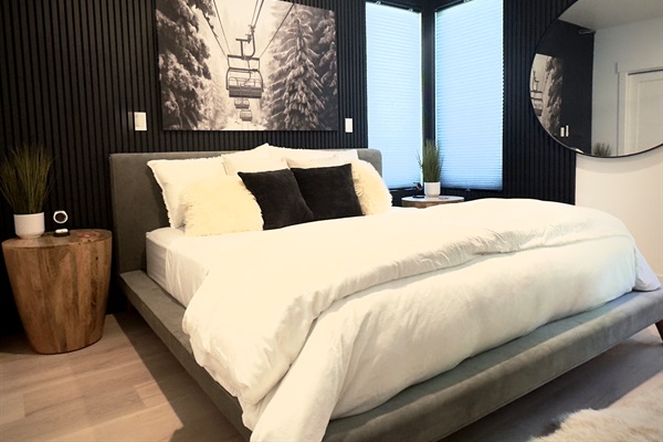 Wood and felt slats surround the plush king bed for a sound deadening and cozy atmosphere
