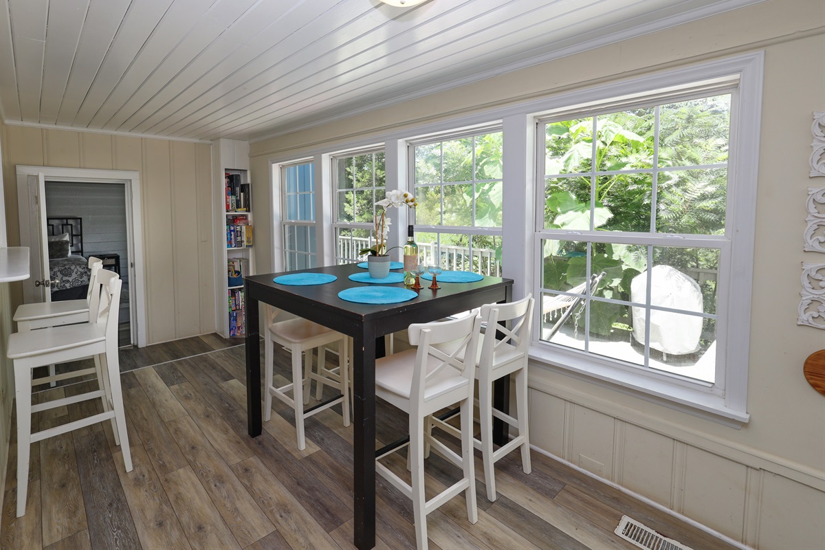 Dining area with hightop seating and pass through bar top seating