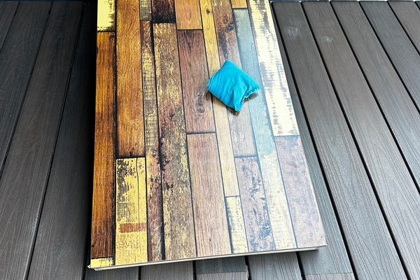 Enjoy a game of corn hole with your friends on the rooftop