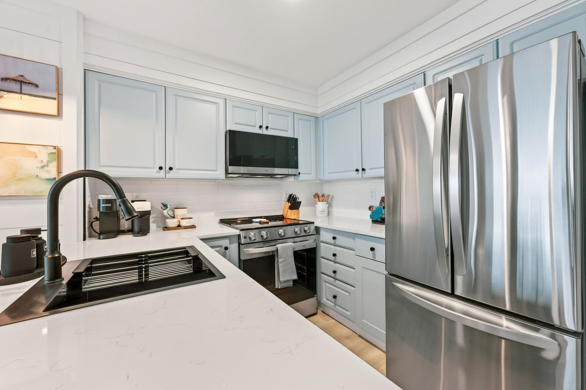 Stylish kitchen with high-end appliances in El Secreto Azul condo