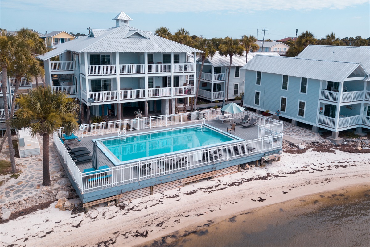 Enjoy the pool or lounge down on the sand by the Gulf