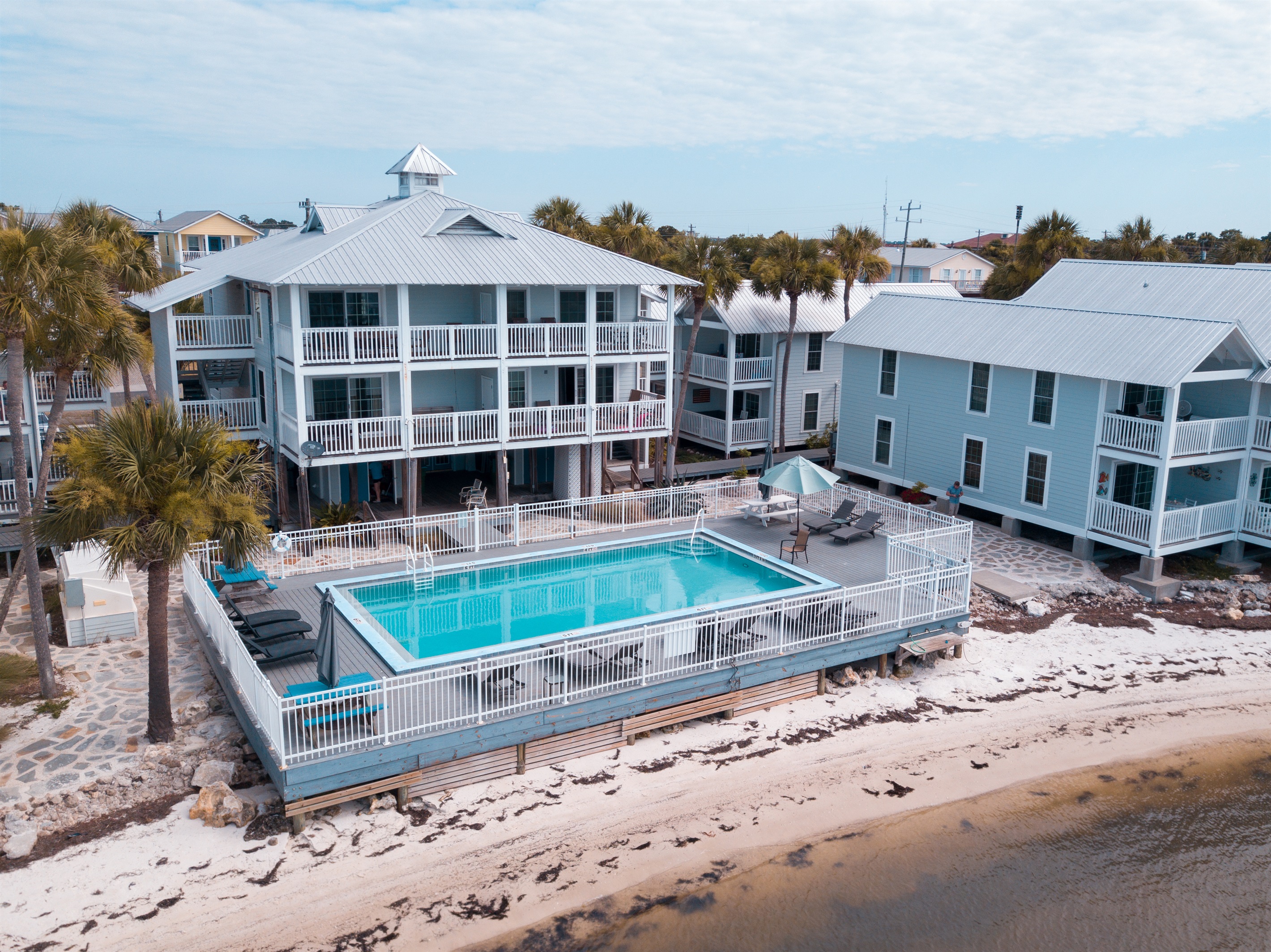 Enjoy the pool or lounge down on the sand by the Gulf