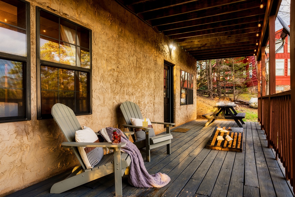 The porch has chairs, a picnic table, and scenic views—a perfect place to relax and enjoy the beauty of nature.  