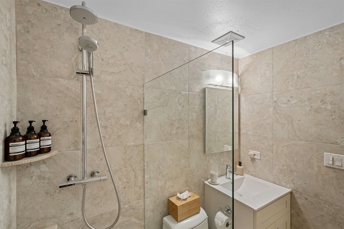 First guest bathroom on the left after the kitchen