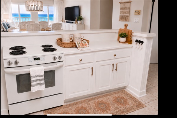 well-equipped kitchen facing the Gulf!  Kitchen barstools at counter with seating for 3, Seating for four at dining table