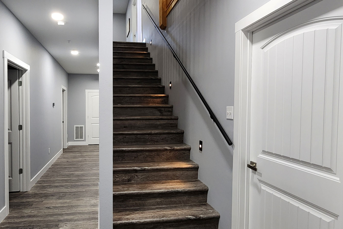 Interior staircase linking shared spaces and sleeping areas.