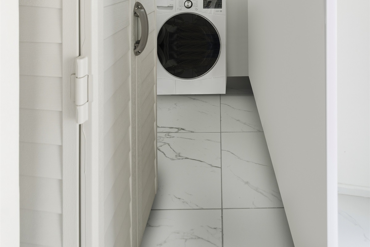 In-unit laundry with washer and dryer for long-stay convenience right off of the entryway