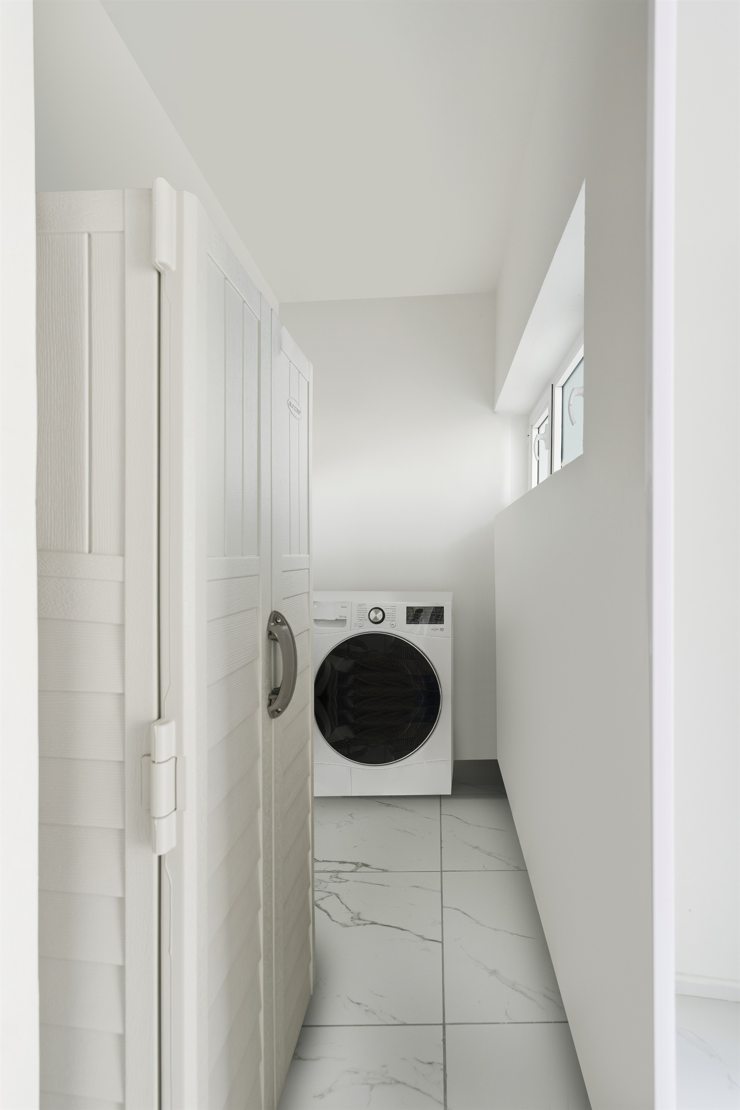 In-unit laundry with washer and dryer for long-stay convenience right off of the entryway