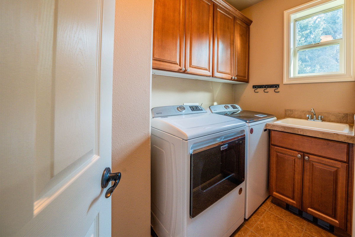 Laundry room with Maytag washer & dryer.  