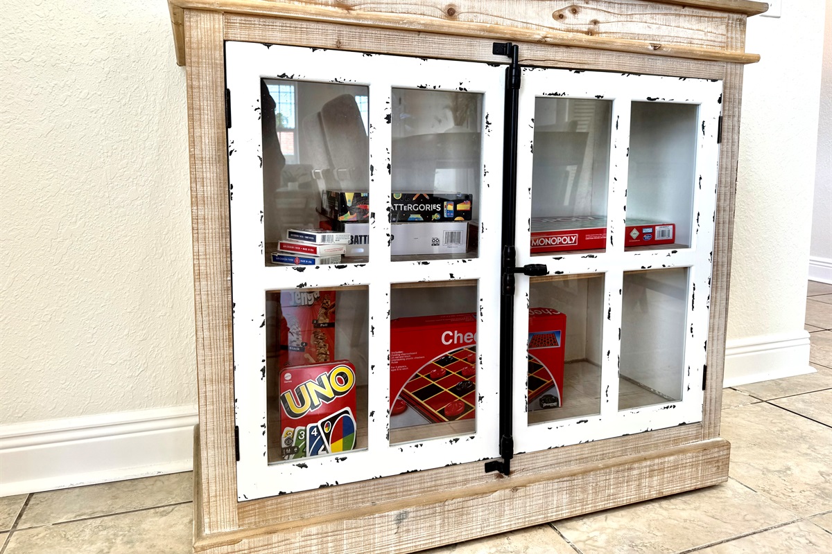 This farmhouse-style cabinet holds a treasure trove of fun! Stocked with board games and card classics, it’s the perfect setup for cozy nights in or rainy day fun for all ages.