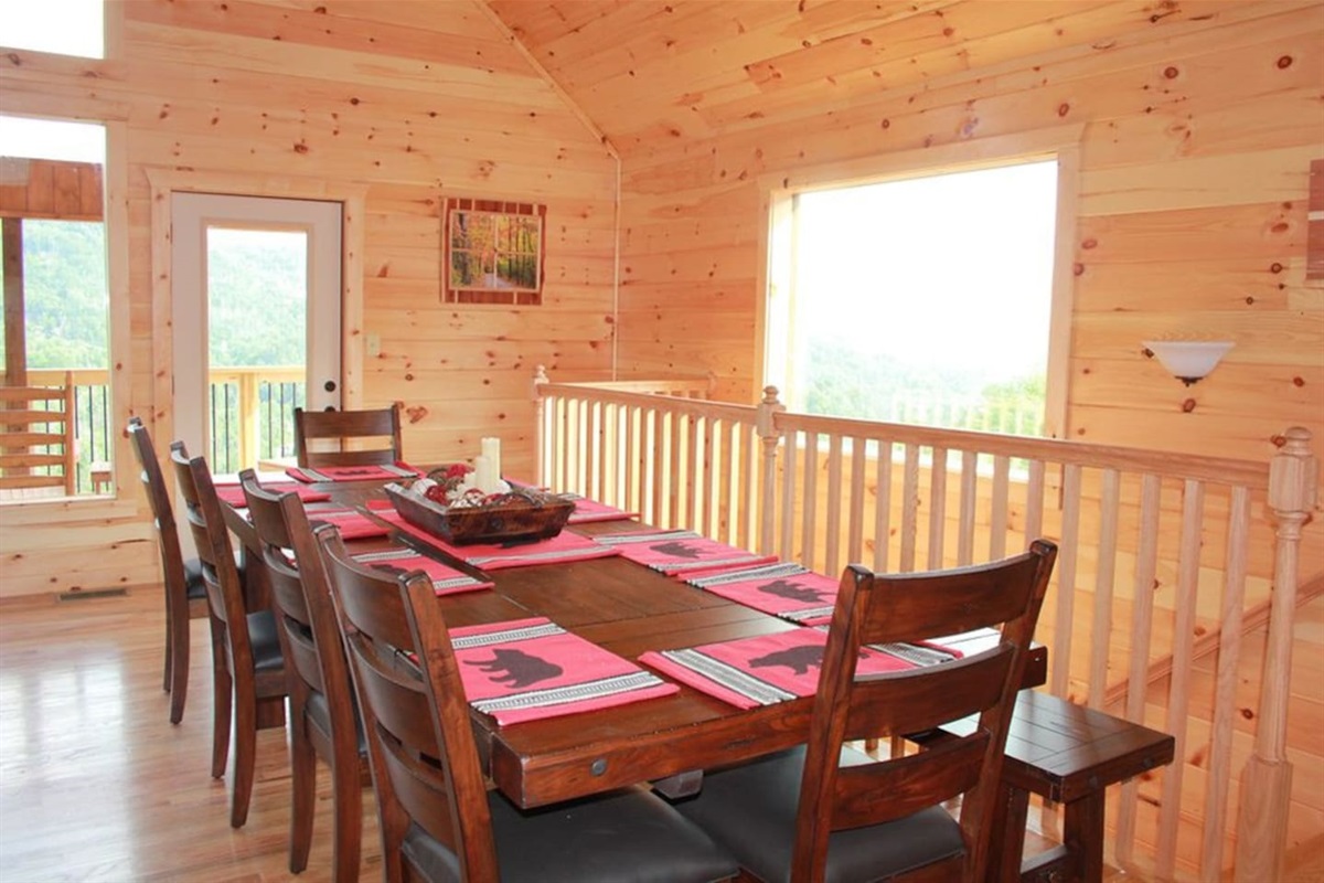 Large dining room table with 6 padded chairs and 2 benches