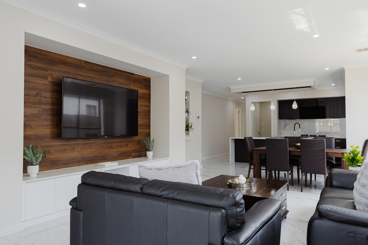 The open living area at Willows Stays Holiday brings the kitchen, dining and lounge together in one bright, easy space for the stay.